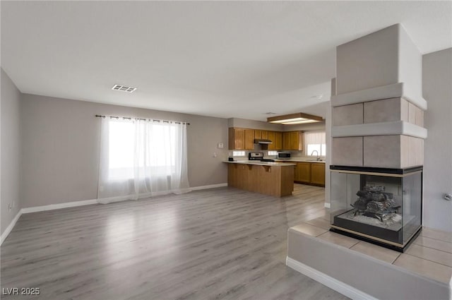 5204 Padua Way, Las Vegas, NV 89107 - unfurnished living room with a sink and light wood finished floors