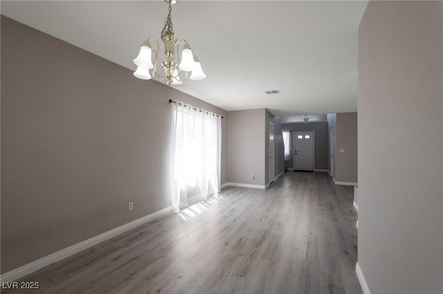 5204 Padua Way, Las Vegas, NV 89107 - empty room with a chandelier and wood finished floors