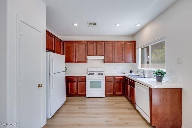 5013 Diamond Ranch Ave, Las Vegas, NV 89131 - kitchen with white appliances, recessed lighting, light wood-style flooring, under cabinet range hood, and light countertops