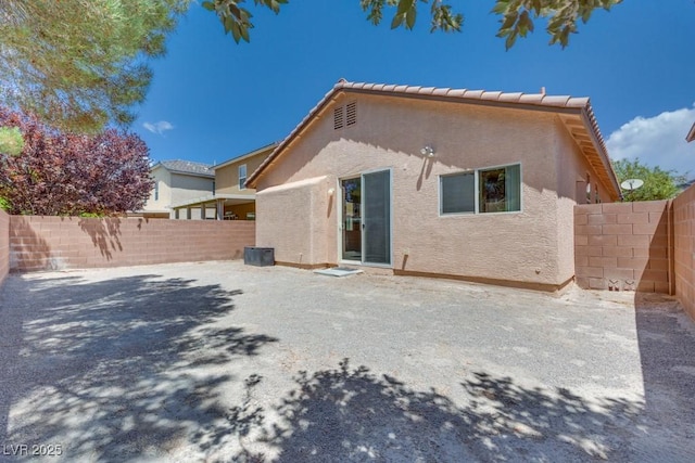 5013 Diamond Ranch Ave, Las Vegas, NV 89131 - rear view of property featuring stucco siding and a fenced backyard