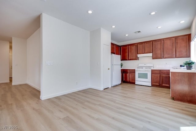 5013 Diamond Ranch Ave, Las Vegas, NV 89131 - kitchen with white appliances, light wood-style floors, recessed lighting, under cabinet range hood, and light countertops