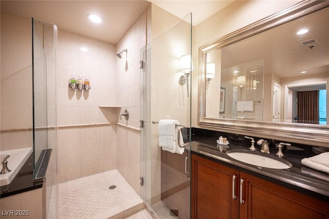 135 E Harmon Ave Unit 414, Las Vegas, NV 89109 - bathroom featuring a stall shower, vanity, and recessed lighting
