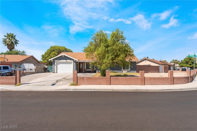 170 Palisade Ave, Las Vegas, NV 89110 - ranch-style house with concrete driveway, a fenced front yard, and an attached garage