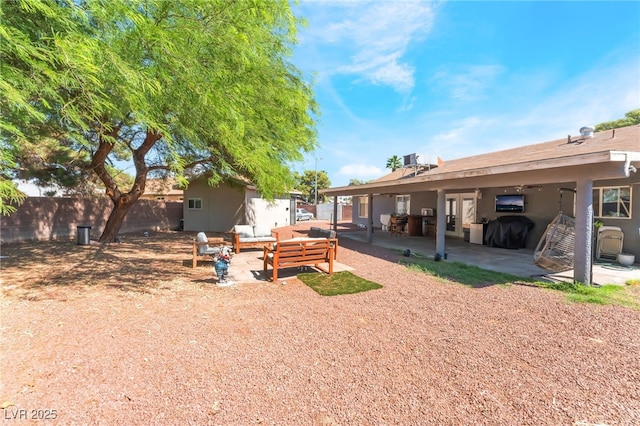 170 Palisade Ave, Las Vegas, NV 89110 - fenced backyard featuring an outdoor living space and a patio