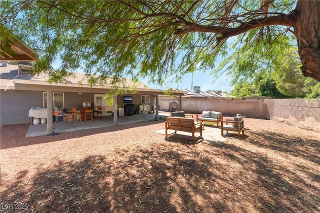 170 Palisade Ave, Las Vegas, NV 89110 - fenced backyard featuring a patio and an outdoor hangout area