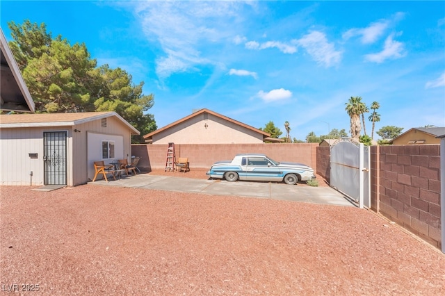 170 Palisade Ave, Las Vegas, NV 89110 - view of yard featuring an outbuilding, a gate, and a patio