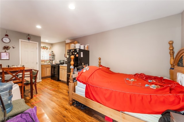 170 Palisade Ave, Las Vegas, NV 89110 - bedroom featuring light wood finished floors, recessed lighting, and freestanding refrigerator