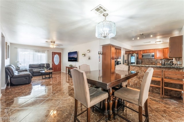 170 Palisade Ave, Las Vegas, NV 89110 - dining area featuring a chandelier, ceiling fan, and marble finish floors