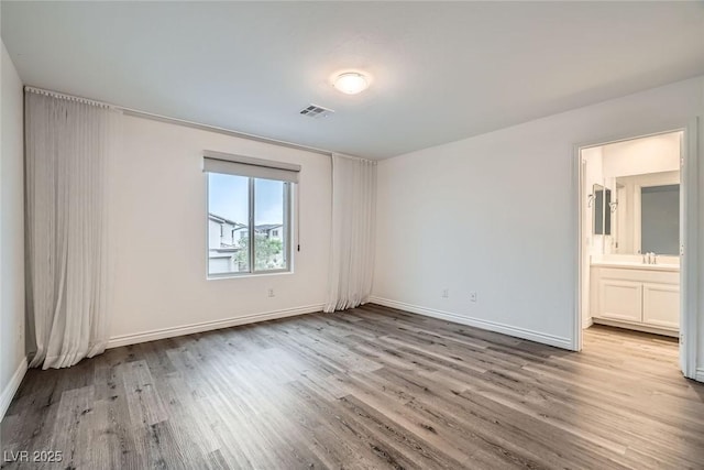 1009 Bluebell Brook St, Henderson, NV 89052 - unfurnished room with wood finished floors and baseboards