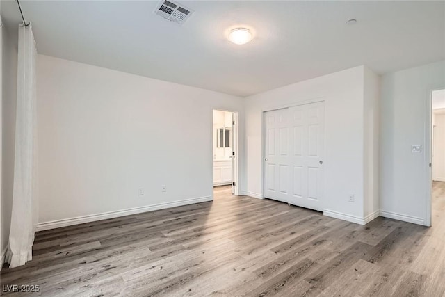 1009 Bluebell Brook St, Henderson, NV 89052 - unfurnished bedroom with wood finished floors, a closet, and ensuite bathroom
