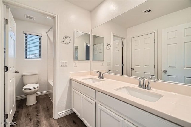 1009 Bluebell Brook St, Henderson, NV 89052 - bathroom featuring double vanity, wood finished floors, and shower / tub combination