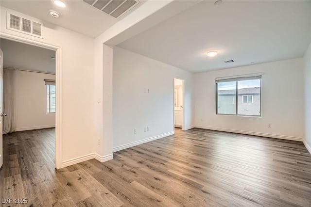 1009 Bluebell Brook St, Henderson, NV 89052 - empty room featuring wood finished floors and a smoke detector