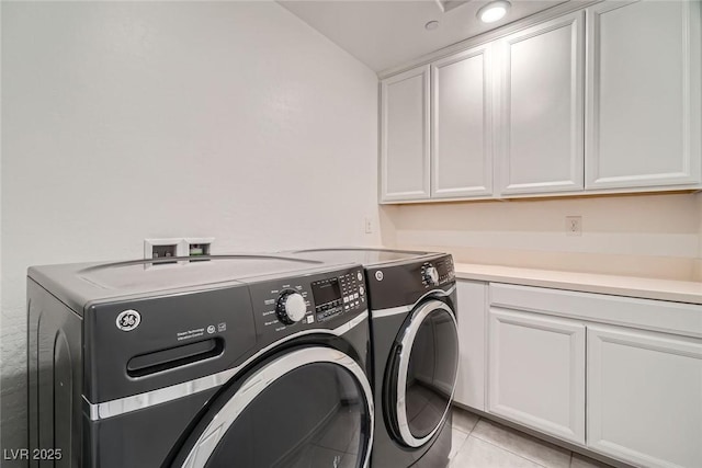 1009 Bluebell Brook St, Henderson, NV 89052 - laundry area featuring independent washer and dryer, cabinet space, and light tile patterned flooring