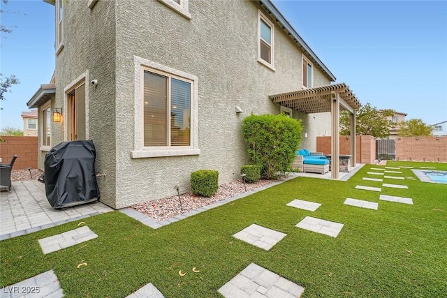 1009 Bluebell Brook St, Henderson, NV 89052 - back of house with a patio, a pergola, stucco siding, and a fenced backyard