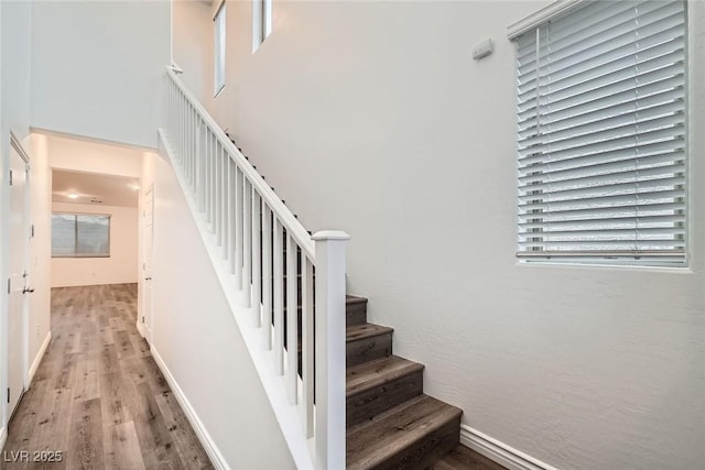 1009 Bluebell Brook St, Henderson, NV 89052 - staircase featuring wood finished floors and healthy amount of natural light