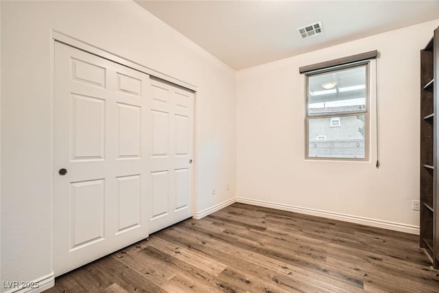 1009 Bluebell Brook St, Henderson, NV 89052 - unfurnished bedroom featuring wood finished floors and a closet