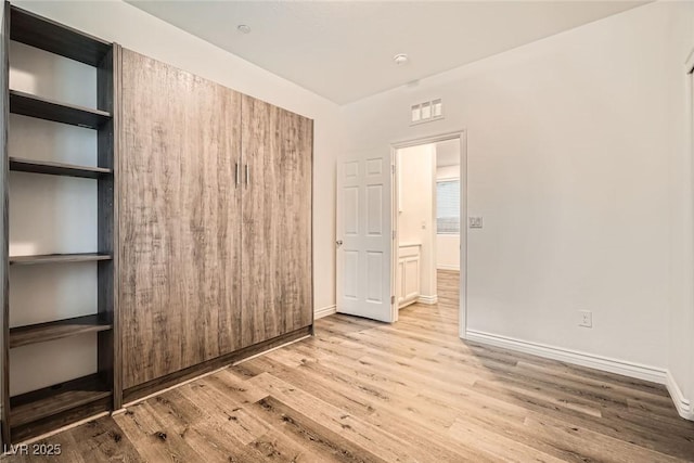 1009 Bluebell Brook St, Henderson, NV 89052 - unfurnished room featuring wood finished floors and baseboards