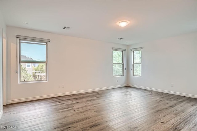 1009 Bluebell Brook St, Henderson, NV 89052 - empty room with wood finished floors and baseboards