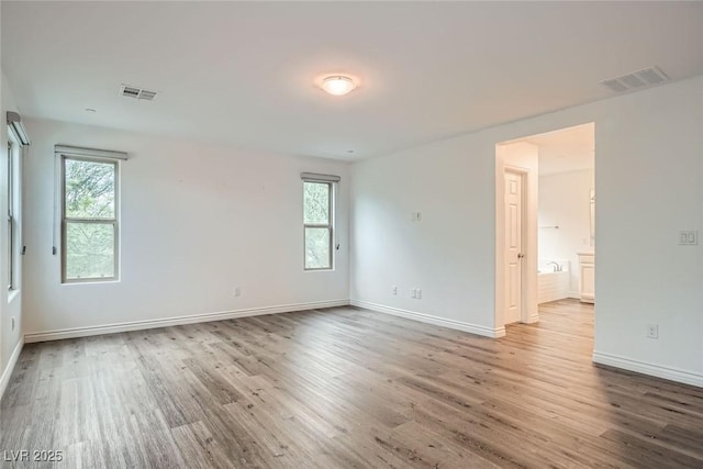 1009 Bluebell Brook St, Henderson, NV 89052 - spare room with wood finished floors and plenty of natural light