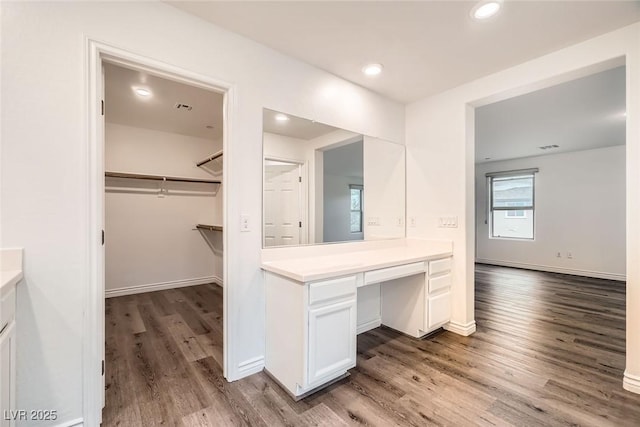 1009 Bluebell Brook St, Henderson, NV 89052 - bathroom with vanity, wood finished floors, a spacious closet, and recessed lighting