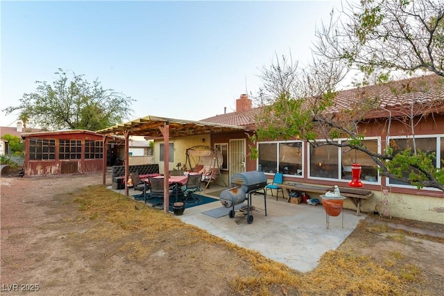 744 Milstead Ct, Las Vegas, NV 89110 - rear view of property with a patio area and a chimney
