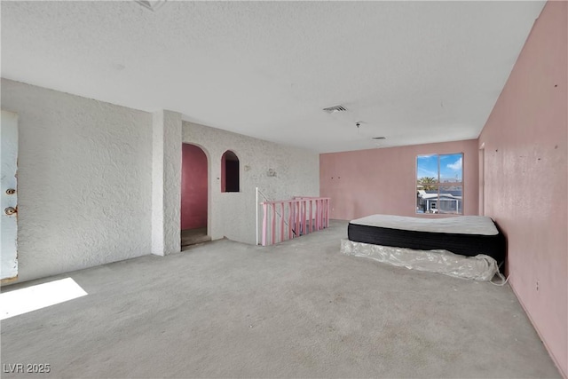 3009 Merritt Ave, Las Vegas, NV 89102 - interior space with carpet flooring, arched walkways, and a textured wall