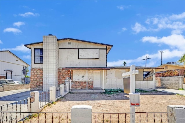 3009 Merritt Ave, Las Vegas, NV 89102 - view of front of house featuring a fenced front yard and brick siding