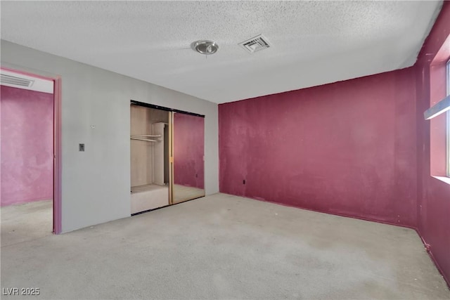 3009 Merritt Ave, Las Vegas, NV 89102 - unfurnished bedroom featuring carpet flooring, a textured ceiling, and a closet