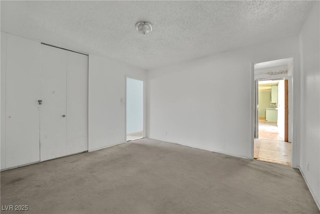 3009 Merritt Ave, Las Vegas, NV 89102 - unfurnished bedroom featuring a textured ceiling, carpet floors, and a closet