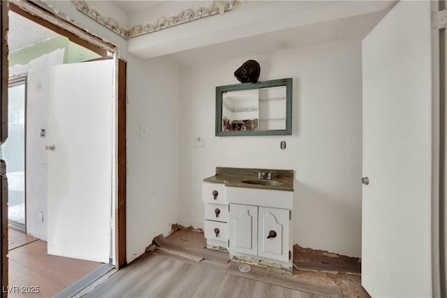 3009 Merritt Ave, Las Vegas, NV 89102 - bathroom featuring vanity, wood finished floors, and plenty of natural light