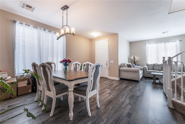 1014 Lone Pine River Ave, Henderson, NV 89002 - dining area with dark wood-style floors, a chandelier, and stairway