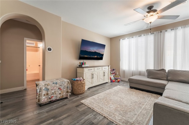 1014 Lone Pine River Ave, Henderson, NV 89002 - living room featuring a ceiling fan, arched walkways, and wood finished floors