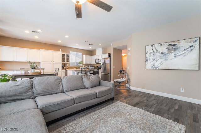 1014 Lone Pine River Ave, Henderson, NV 89002 - living area featuring dark wood finished floors, ceiling fan, and recessed lighting