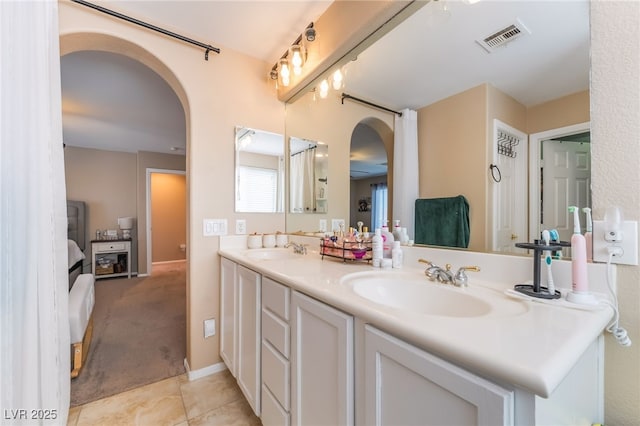1014 Lone Pine River Ave, Henderson, NV 89002 - full bathroom featuring double vanity and tile patterned flooring