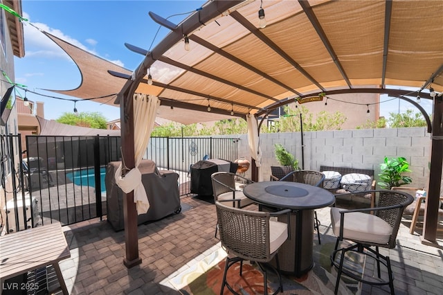 1014 Lone Pine River Ave, Henderson, NV 89002 - fenced backyard with outdoor dining space, a patio, and grilling area