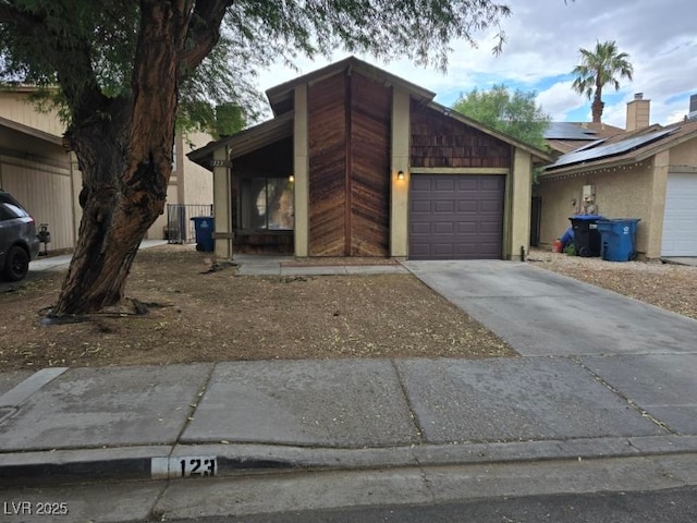 123 Sirnoble St, Las Vegas, NV 89110 - view of front of property with concrete driveway and a garage