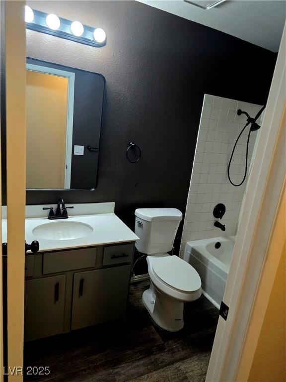 123 Sirnoble St, Las Vegas, NV 89110 - full bathroom with vanity, wood finished floors, shower / bath combination, and a textured wall
