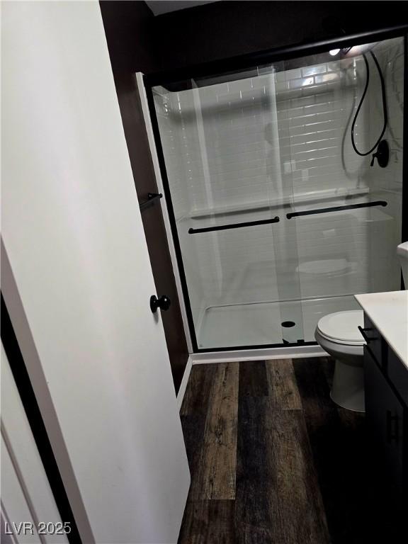123 Sirnoble St, Las Vegas, NV 89110 - bathroom featuring vanity, wood finished floors, and a stall shower