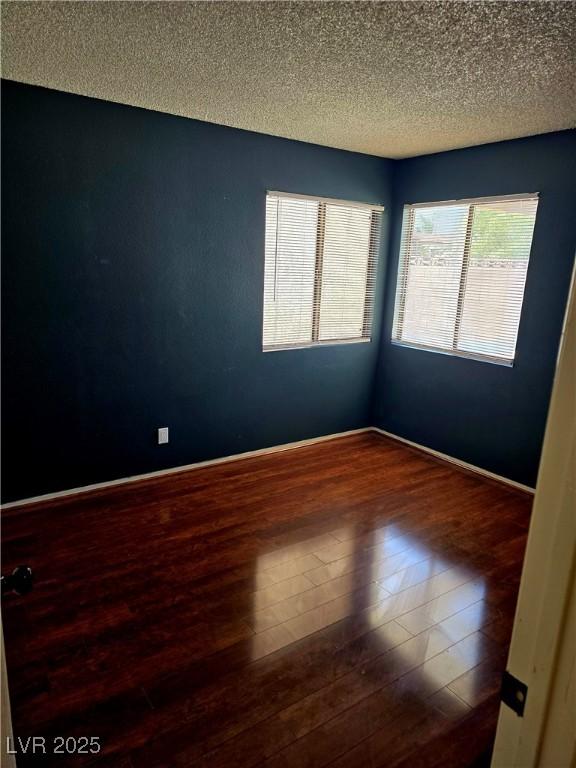 123 Sirnoble St, Las Vegas, NV 89110 - unfurnished room featuring wood finished floors and a textured ceiling
