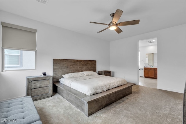1309 Azure Jay Ave, North Las Vegas, NV 89084 - bedroom with light colored carpet, ensuite bathroom, and a ceiling fan