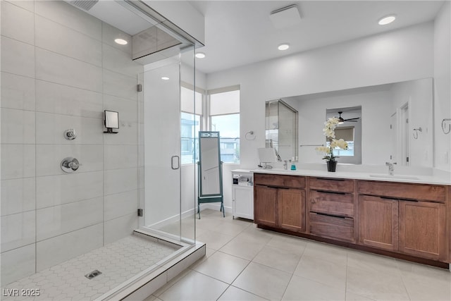 1309 Azure Jay Ave, North Las Vegas, NV 89084 - full bathroom featuring a shower stall, double vanity, tile patterned floors, ceiling fan, and recessed lighting