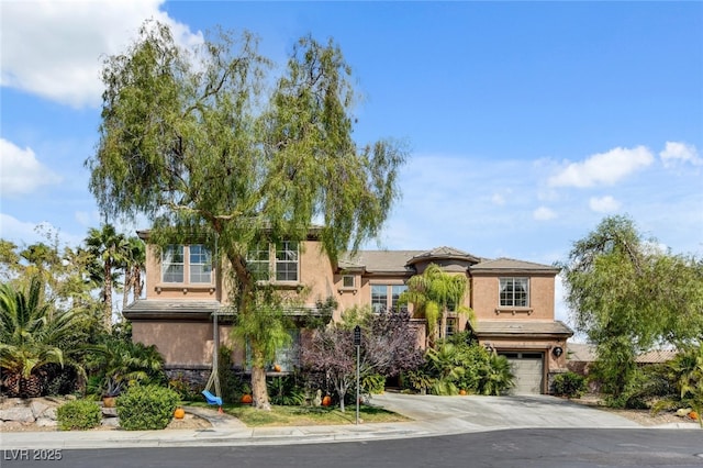 10960 Bethel Park Ct, Las Vegas, NV 89141 - view of front of home with driveway, a garage, and stucco siding