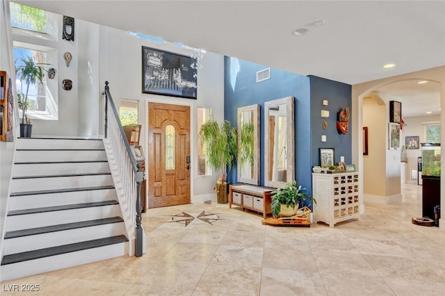 10960 Bethel Park Ct, Las Vegas, NV 89141 - entrance foyer with recessed lighting, arched walkways, stairs, and light tile patterned floors