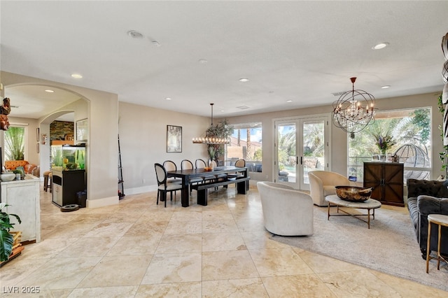 10960 Bethel Park Ct, Las Vegas, NV 89141 - living room with healthy amount of natural light, a chandelier, recessed lighting, and french doors