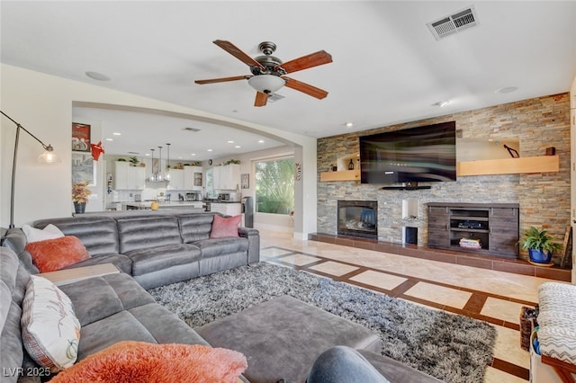 10960 Bethel Park Ct, Las Vegas, NV 89141 - tiled living room featuring a fireplace, ceiling fan, and recessed lighting