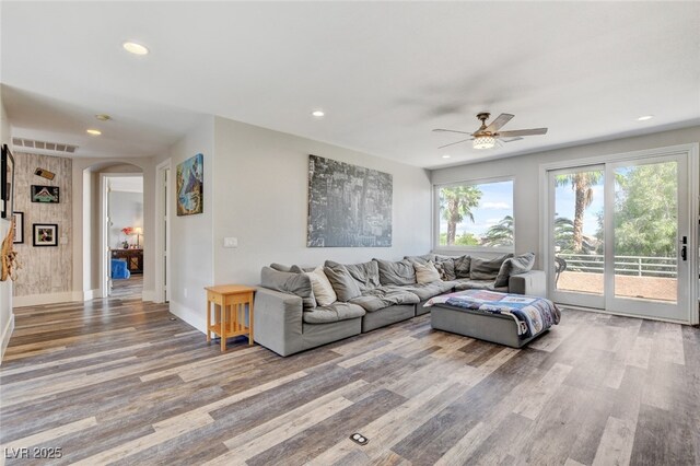 10960 Bethel Park Ct, Las Vegas, NV 89141 - living room featuring wood finished floors, a ceiling fan, arched walkways, and recessed lighting