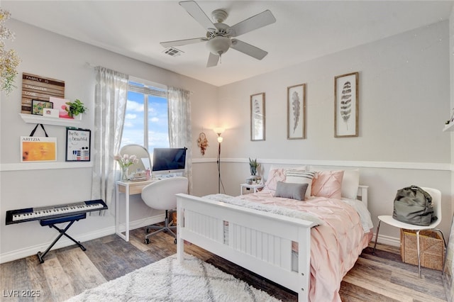 10960 Bethel Park Ct, Las Vegas, NV 89141 - bedroom featuring wood finished floors, an office area, and a ceiling fan