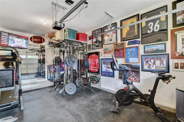 10960 Bethel Park Ct, Las Vegas, NV 89141 - garage with a garage door opener and baseboards