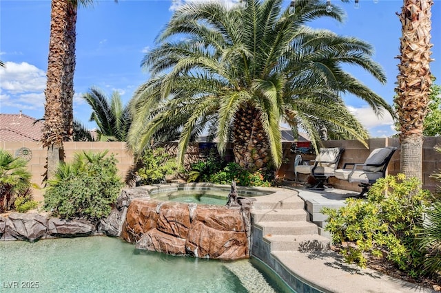 10960 Bethel Park Ct, Las Vegas, NV 89141 - view of swimming pool with an in-ground hot tub and a small pond