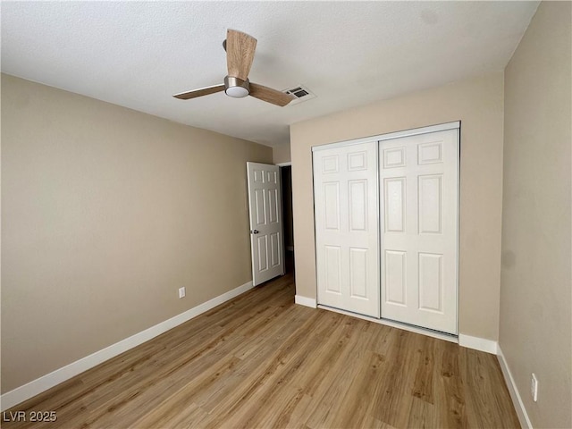 8600 W Charleston Blvd Unit 2161, Las Vegas, NV 89117 - unfurnished bedroom with light wood finished floors, a closet, and ceiling fan